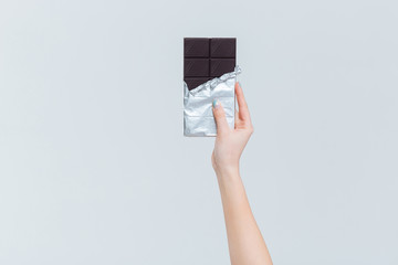 Female hand holding chocolate