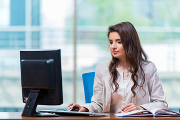 Businesswoman sitting at the office desk