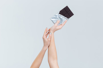 Female hands holding chocolate