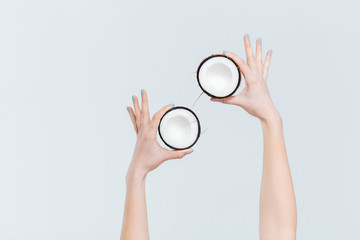 Female hands holding coconut
