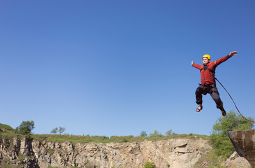 Jump off the cliff with a rope.