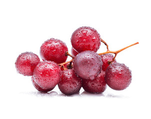 Red grapes and water drops isolated on white background