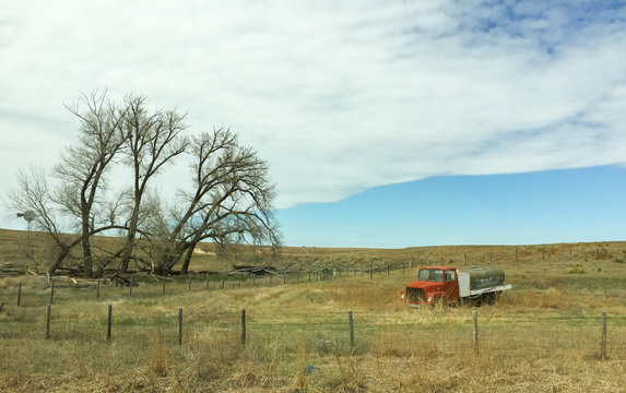 Abadoned Tank Truck in grassy field