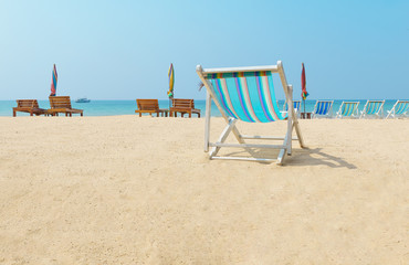 canvas beach bed on the beach with nice sky and cloud
