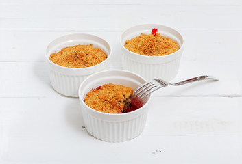 Crumbles with raspberries, gooseberries and blackberries