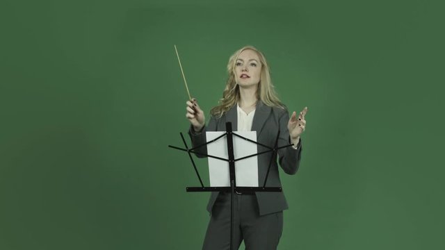 caucasian businesswoman isolated on chroma green screen background happy conductor