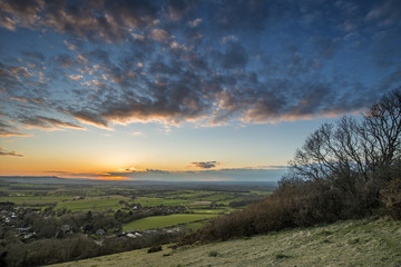 Obraz premium Beautiful landscape image of sunset over countryside landscape i
