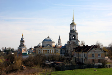 Fototapeta na wymiar Provincial town skyline - old shabby yellow russian orthodox mon