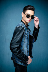 Obraz premium Portrait of a young handsome teenager boy. Model wearing stylish casual clothes. City lifestyle. Male fashion, street style concept.