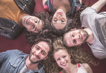 Group of friends taking portrait on the floor