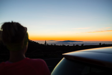 Woman hiker looking at inspiring landscape ocean view