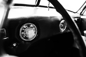 Naklejka premium Vintage car speedometer. Close up shot of the dashboard at class
