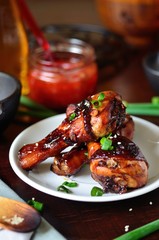 Grilled chicken legs with sesame seeds, soy sauce, green onions