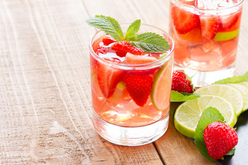 fresh lemonade with strawberries , lime and mint