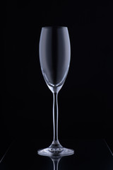 Glass with a long leg on a black background