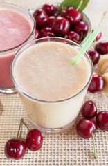 Cherry and banana and milk smoothie. Milkshake with cherries and bananas. 