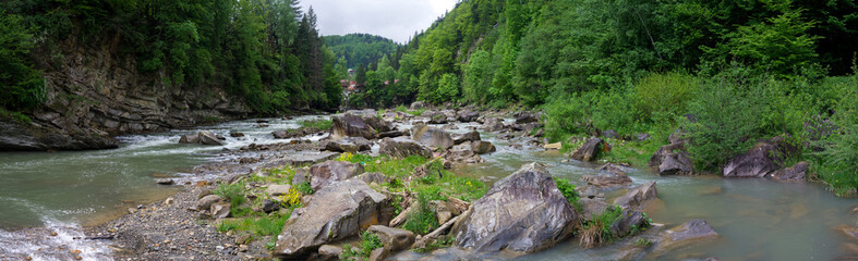 Fototapeta na wymiar Picturesque mountain river with waterfalls in Carpathians High-Resolution Panorama