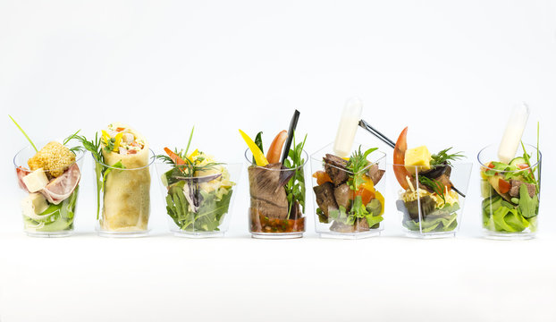 Mini Canape with meat and vegetables in plastic cups