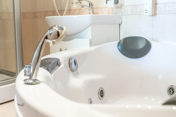 jacuzzi bathtube in white bathroom, house or hotel