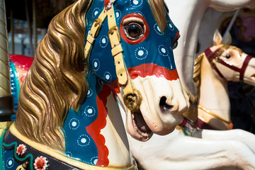 Fototapeta na wymiar Bright vintage carousel in a French Honfleur.