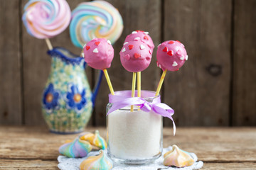 Homemade Cake pops with pink chocolate glaze, and hearts 