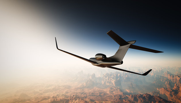 Photo of Black Matte Luxury Generic Design Private Jet Flying in Sky under the Earth Surface. Grand Canyon Background. Business Travel Picture. Horizontal, back angle view. Film Effect. 3D rendering.