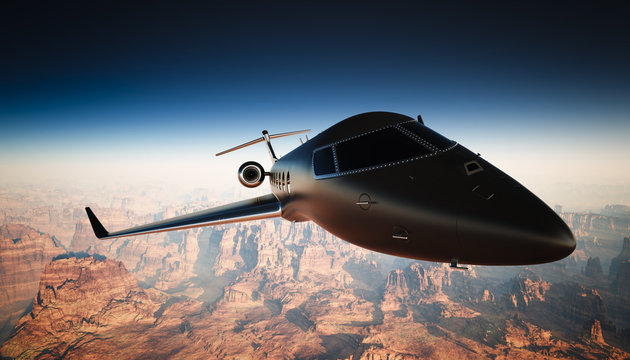 Closeup Black Matte Luxury Generic Design Private Jet Flying in Sky under the Earth Surface. Grand Canyon Background. Business Travel Picture. Horizontal, angle view. Film Effect. 3D rendering.