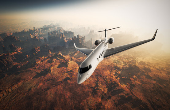 Photo White Glossy Luxury Generic Design Private Jet Flying in Sky under Earth Surface.Grand Canyon Background Sunrise. Business Travel Picture.Horizontal,Top Angle View.Film Effect. 3D rendering.