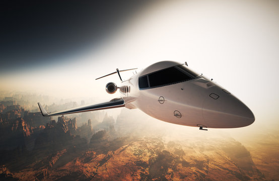 Photo White Glossy Luxury Generic Design Private Jet Flying in Sky under Earth Surface.Grand Canyon Background Sunset. Business Travel Picture.Horizontal,Right Angle View.Film Effect. 3D rendering.