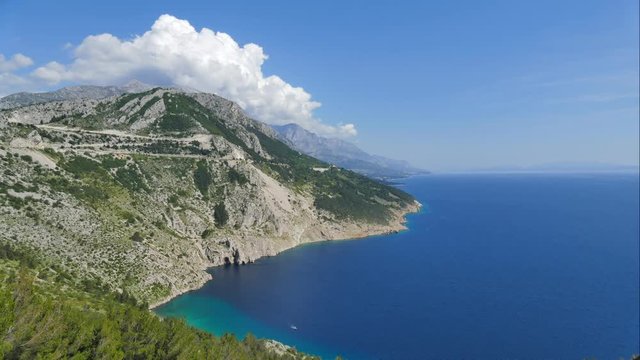 Look at the Makarska Riviera, at the foot of beach Vrulja - Dubci. Mountain and clouds dominate the scene. Time lapse. Spring 2016.