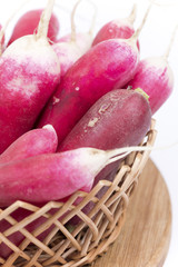 Red radishes in the basket background