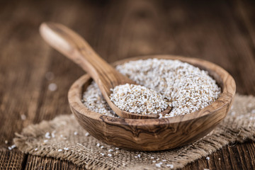 Wooden table with a portion of puffed Amaranth (selective focus)