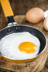 Fried Eggs on wooden background