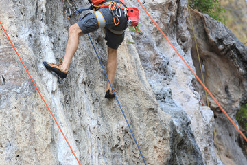 rock climber climbing on the cliff..