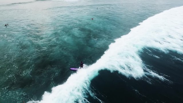 Aerial view of huge ocean waves and surfing in Bali indonesia