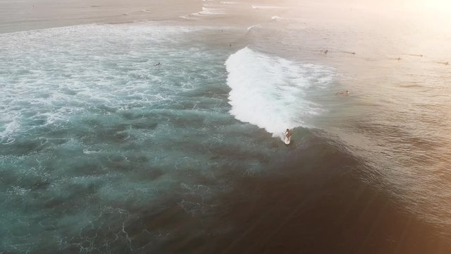 Aerial view of huge ocean waves and surfing in Bali indonesia