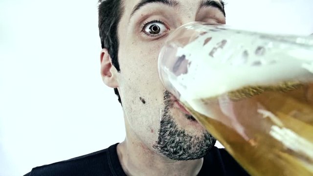 Young man drinking beer 
