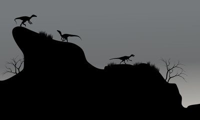 eoraptor in cliff silhouette at night