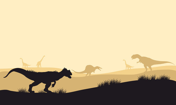 Silhouette of allosaurus at morning with fog