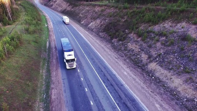 Aerial view of trucks on the road.