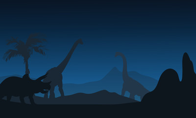 At night silhouette of Triceratops and brachiosaurus