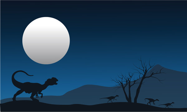 Silhouette of dilophosaurus with moon