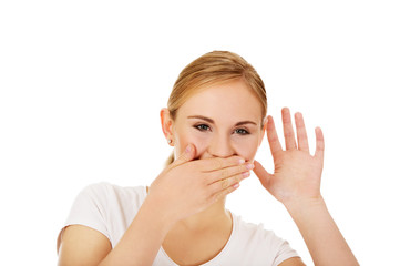 Shocked young woman overhears conversation