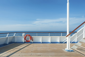 Ship deck, buoy and blue ocean. Travel background