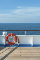 Ship deck, buoy and blue ocean. Travel background