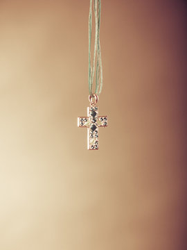 Cross necklace pendant. Christian religion faith.