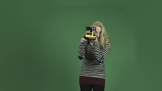 caucasian woman isolated on chroma green screen background photography camera polaroid