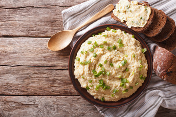 Jewish traditional snack forshmak close-up on the table. Horizontal top view 
