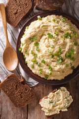 Homemade forshmak and rye bread close-up on the table. vertical top view
