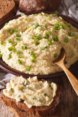 Jewish forshmak with rye bread macro on a plate. vertical
